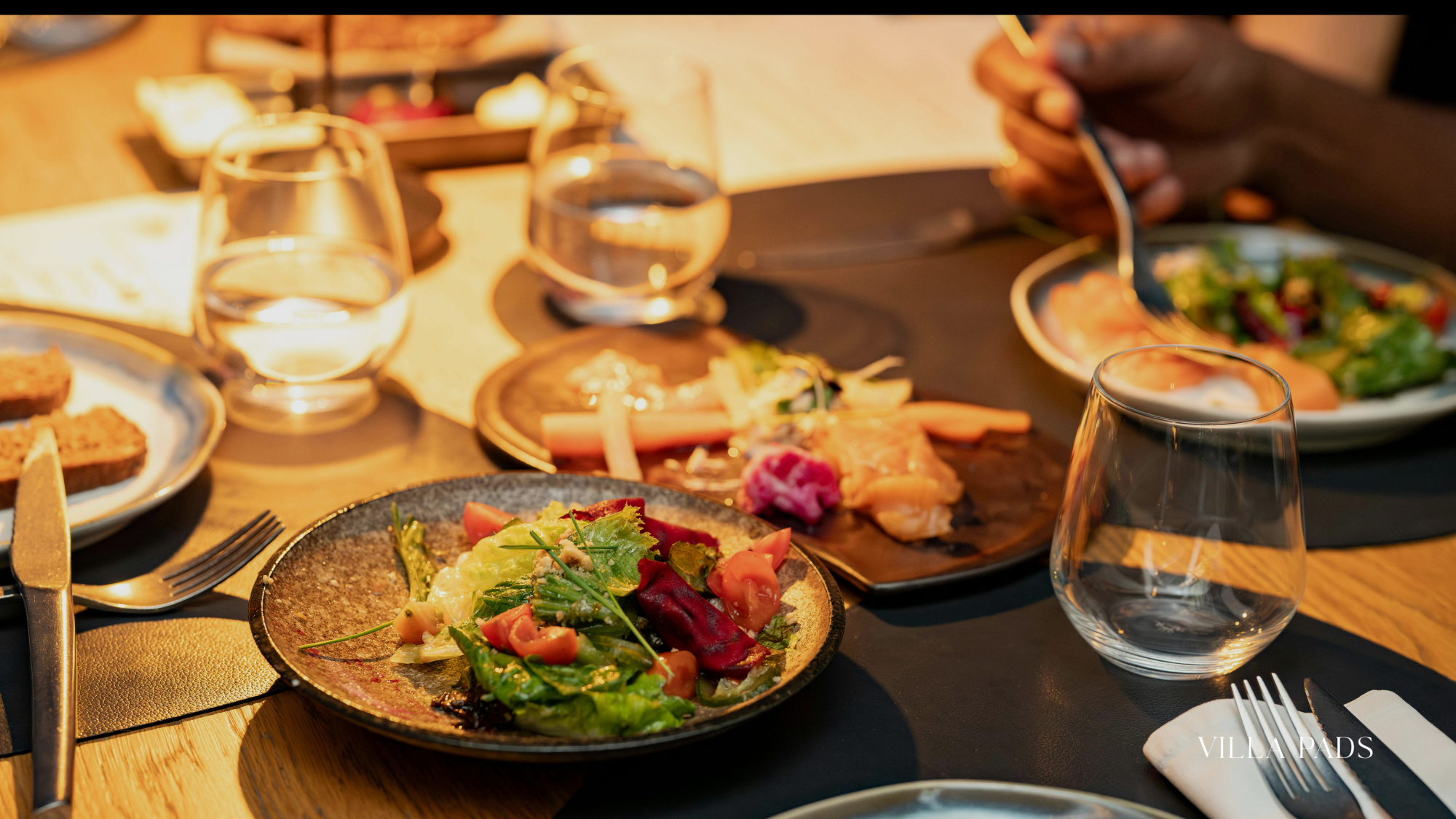 Guests Enjoying Private Chef Dinner Candlelit Villa