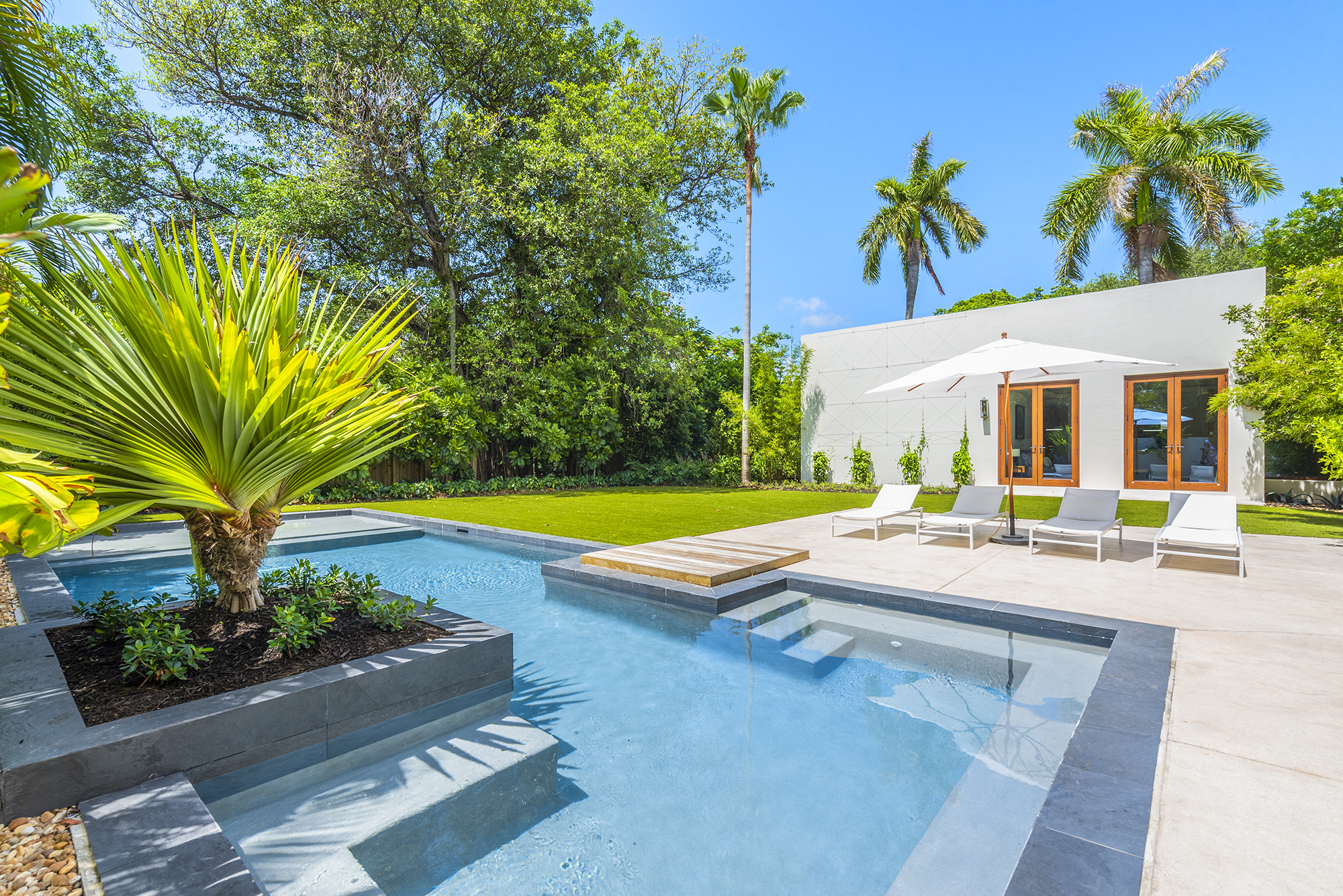 Villa backyard and pool area during day in Miami